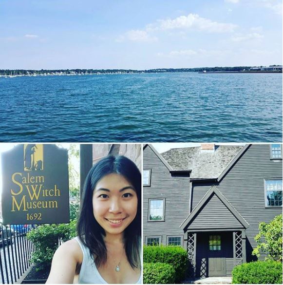 Asian woman in front of Salem Witch Museum sign with a body of water above.