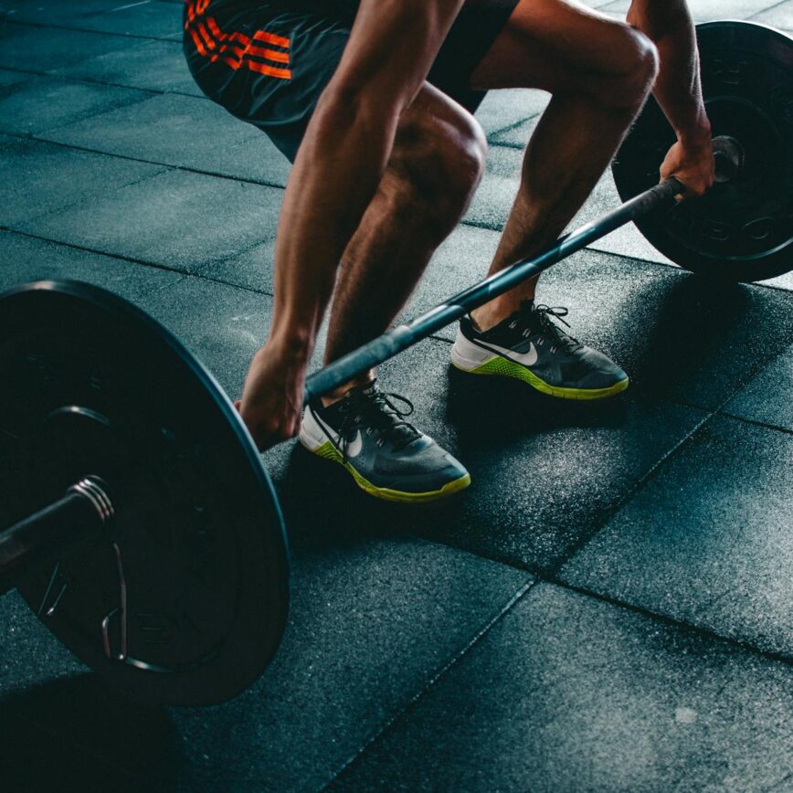 person holding barbell