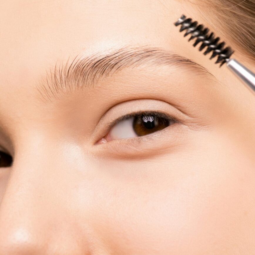 woman applying mascara